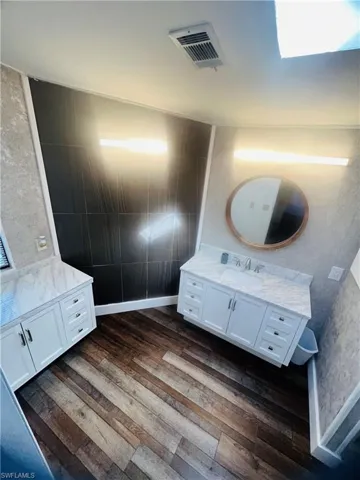 Updated bathroom with clean finishes and modern flooring