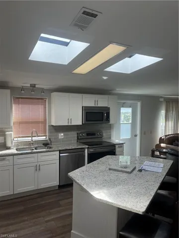 Bright kitchen with skylights that fill the space with natural light..