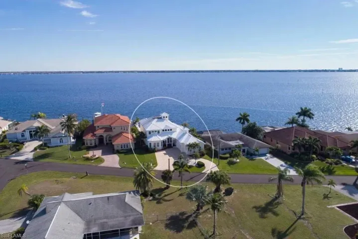 Aerial perspective of suburban area with a large body of water