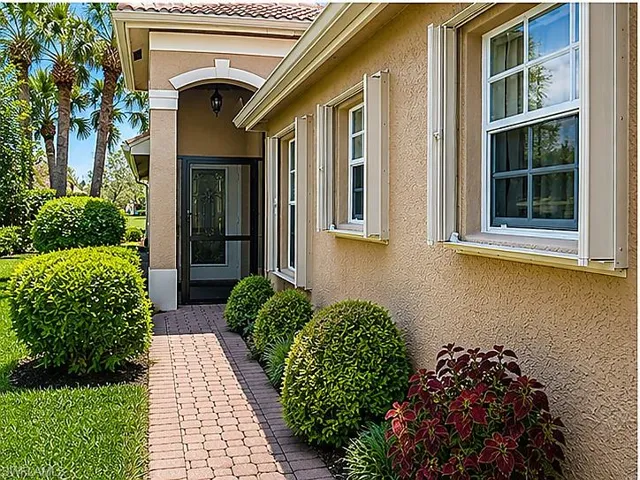 Stunning and well kept home complete with shutters and beautiful landscaping