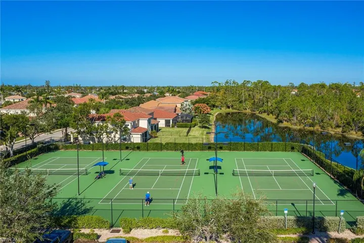 View of sport court with a water view