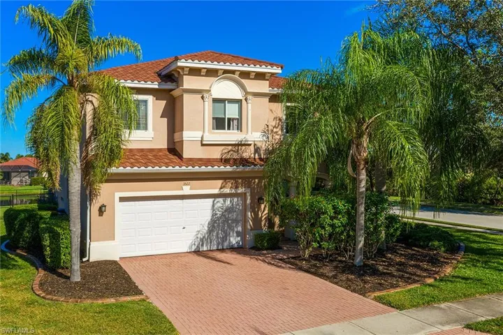 Mediterranean / spanish-style house with a garage