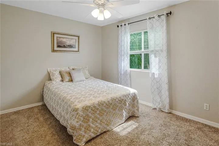 Bedroom featuring carpet floors and ceiling fan