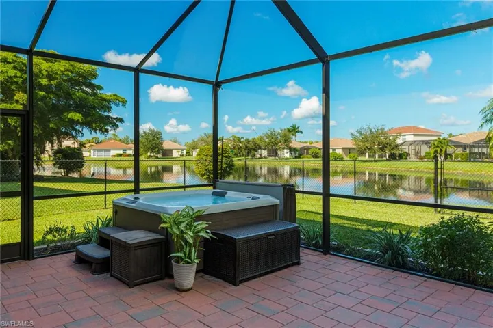 Unfurnished sunroom featuring a water view
