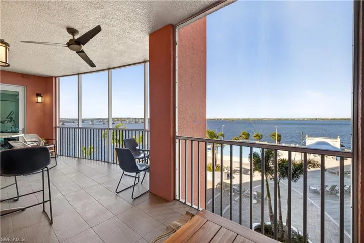 Sunroom with a water view