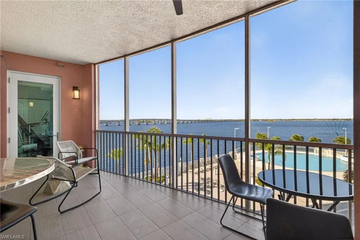 Sunroom / solarium with a water view