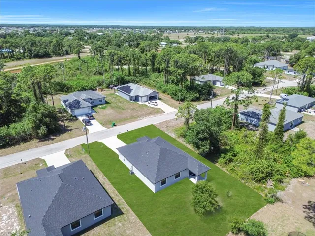 Aerial perspective showcasing a residential street with multiple single-story homes