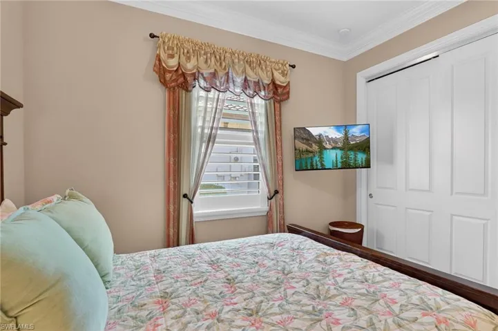 Bedroom featuring a closet and ornamental molding