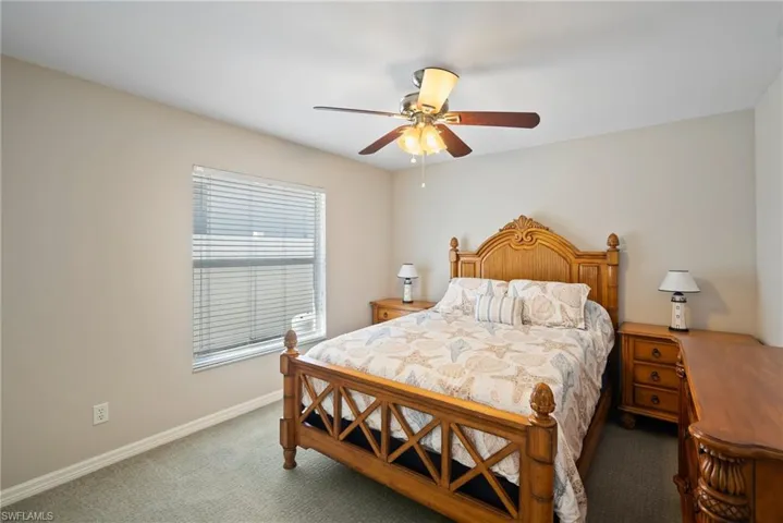 Bedroom with carpet and ceiling fan