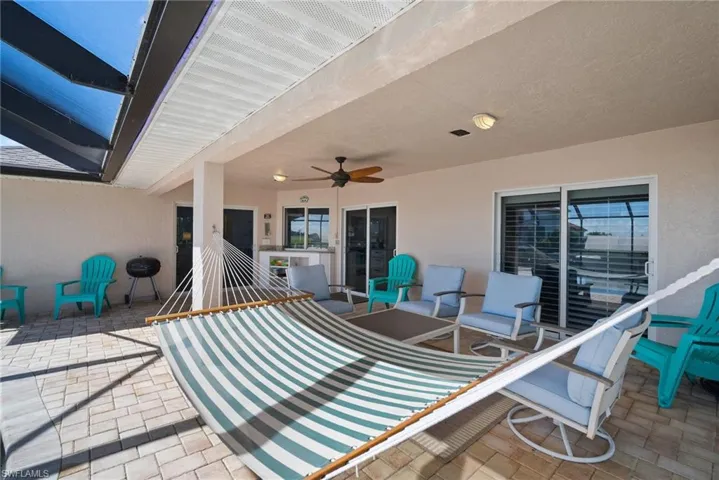 View of patio featuring ceiling fan