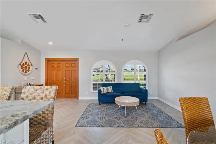 Living room featuring light parquet floors