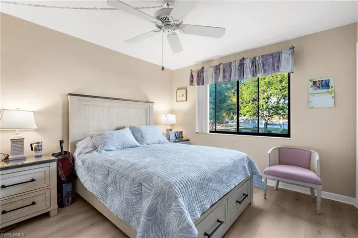 Bedroom featuring light wood-type flooring and ceiling fan