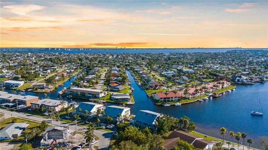 Aerial view of residential area featuring a large body of water