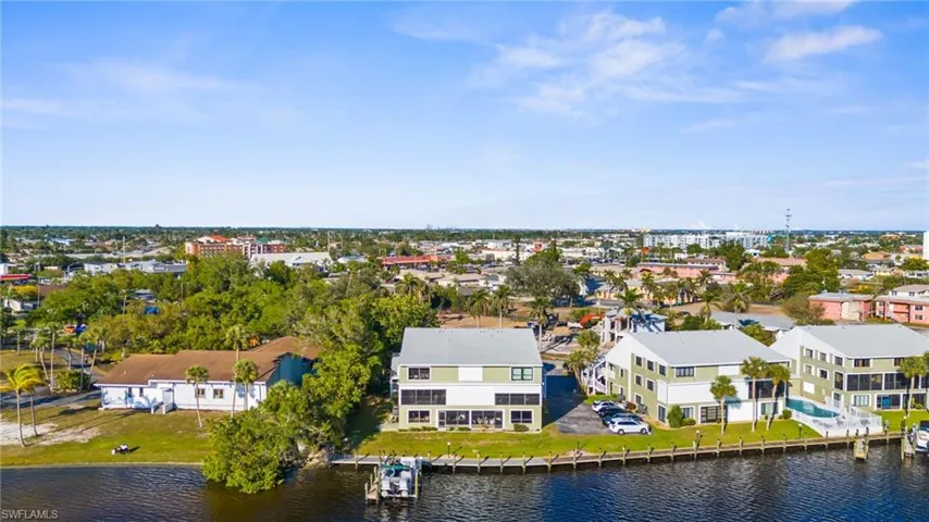 Aerial view of residential area featuring a large body of water
