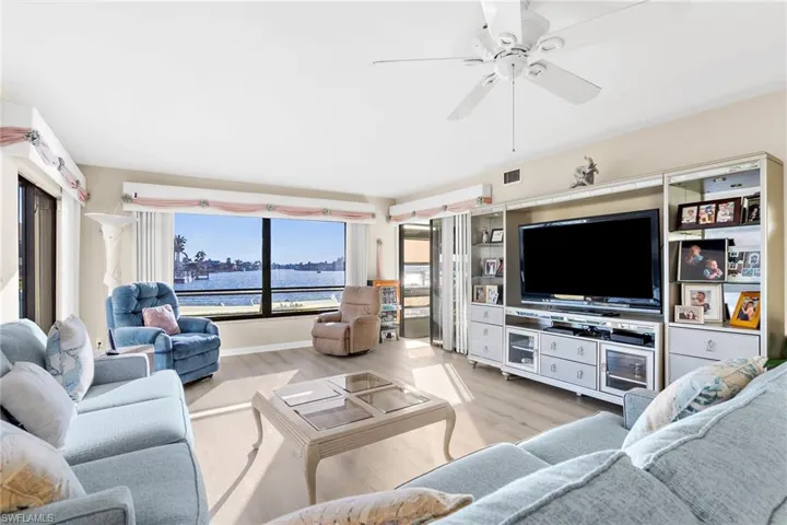 Living room featuring wood finished floors and ceiling fan
