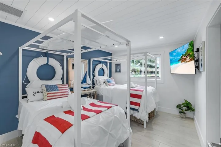 Bedroom with wood-type flooring