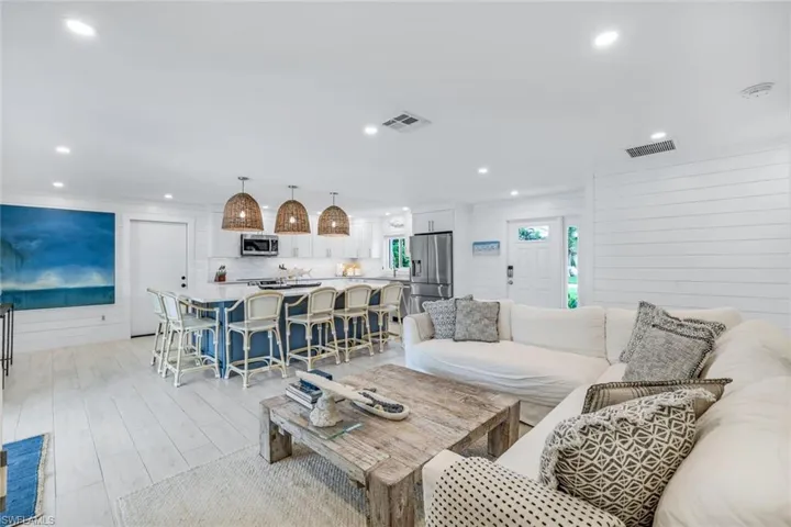 Living room featuring wood walls and light hardwood / wood-style floors