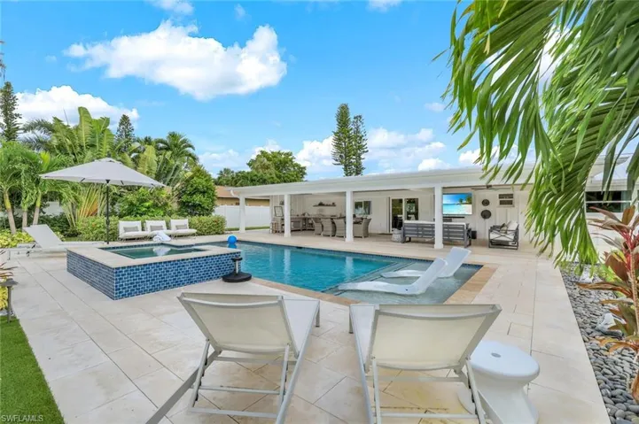 View of swimming pool featuring a patio, an outdoor living space, ceiling fan, and an in ground hot tub