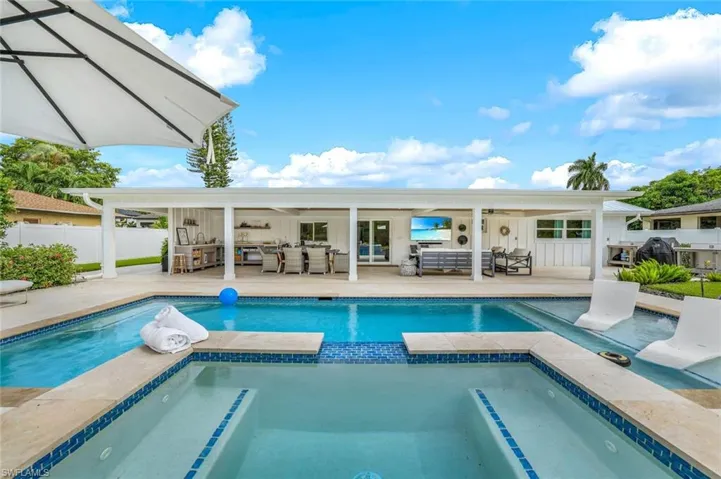 View of pool with an outdoor hangout area, an in ground hot tub, and a patio area
