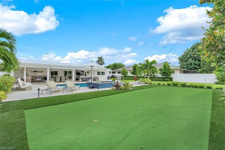 View of property's community with outdoor lounge area and a patio area