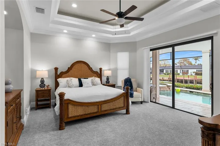 Bedroom with ornamental molding, access to outside, light carpet, a ceiling fan, and recessed lighting