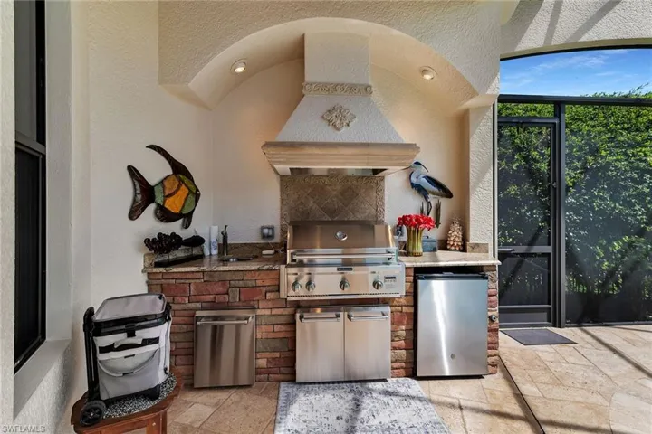 View of patio with exterior kitchen