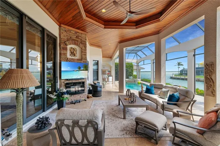 Sunroom with a ceiling fan, an outdoor lounge area, plenty of natural light, and a patio