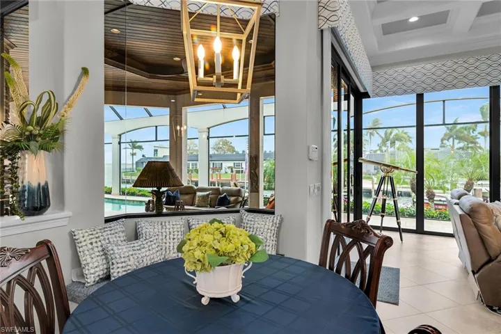 Dining room featuring coffered ceiling and plenty of natural light
