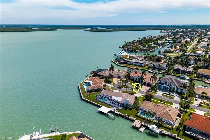 Aerial view of residential area with a nearby body of water