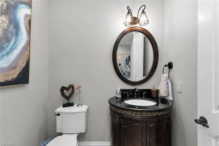 Bathroom featuring vanity and toilet