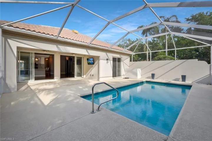 View of swimming pool with a lanai, a patio, and a fenced in pool