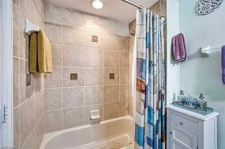 Full bathroom featuring shower / tub combo with curtain