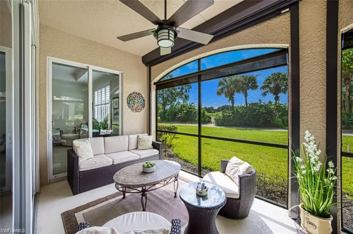 Sunroom featuring ceiling fan and outdoor lounge area