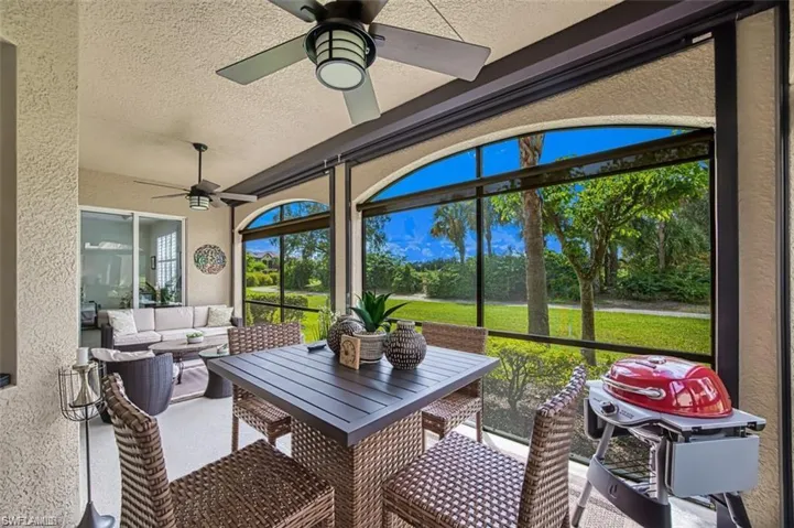 Sunroom / solarium with a ceiling fan and an outdoor hangout area