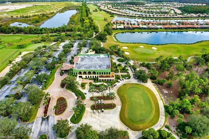 Aerial view of property's location featuring a large body of water and a local golf course