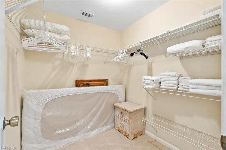 Plenty of storage options in the primary walk-in closet