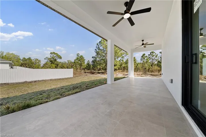 View of patio featuring a ceiling fan