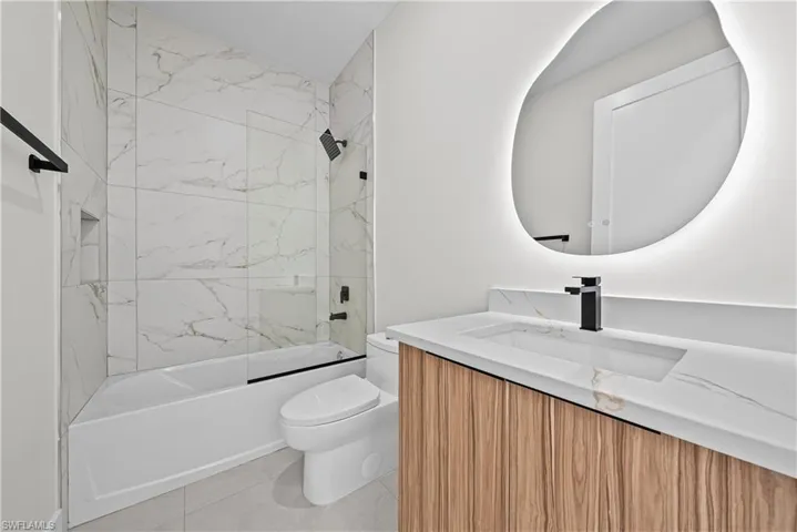 Full bathroom featuring vanity and shower / bath combination