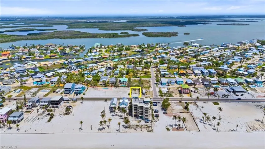 Birds eye view of property featuring a water view and a residential view- Virtually Enhanced