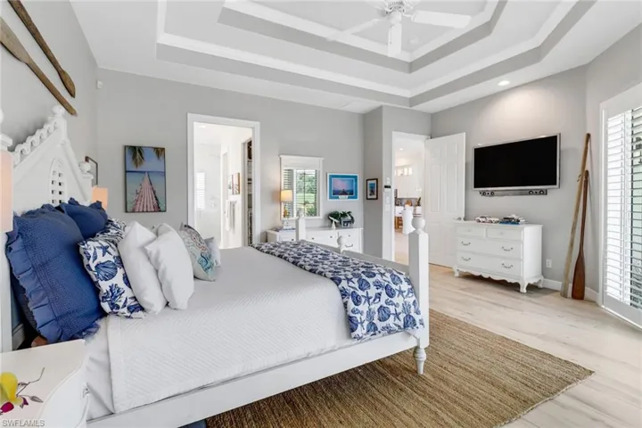 Your primary bedroom features bright, cherry light from all the windows and private sliders out to the pool.