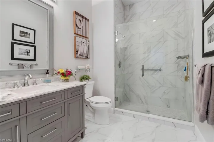 Fully updated Guest Bathroom with vanity and glass shower.