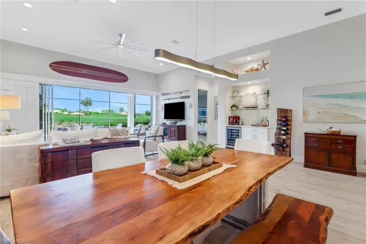 Dining space with modern finishes and built in bar for entertaining.