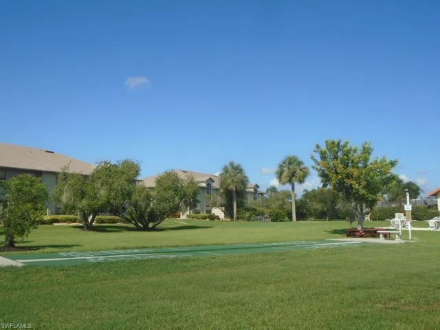Surrounding community featuring a lawn