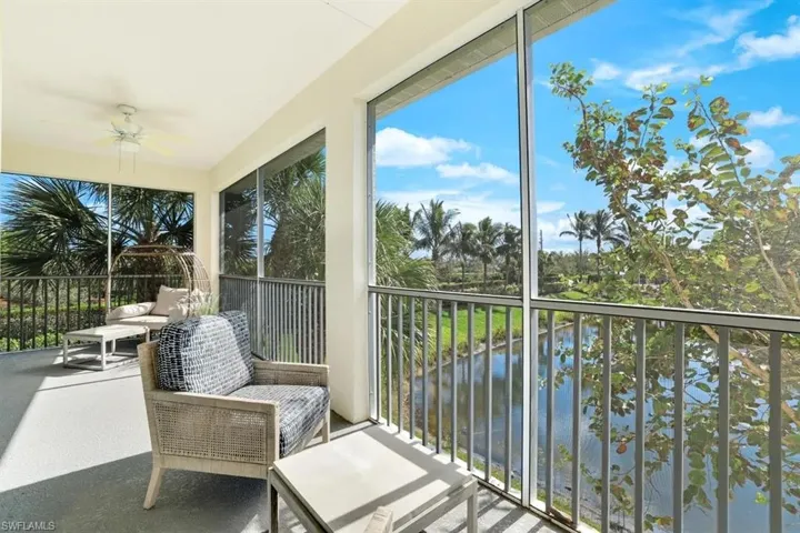 Sunroom / solarium with a water view