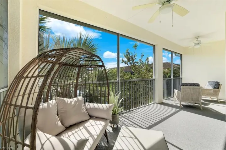 Sunroom featuring a ceiling fan