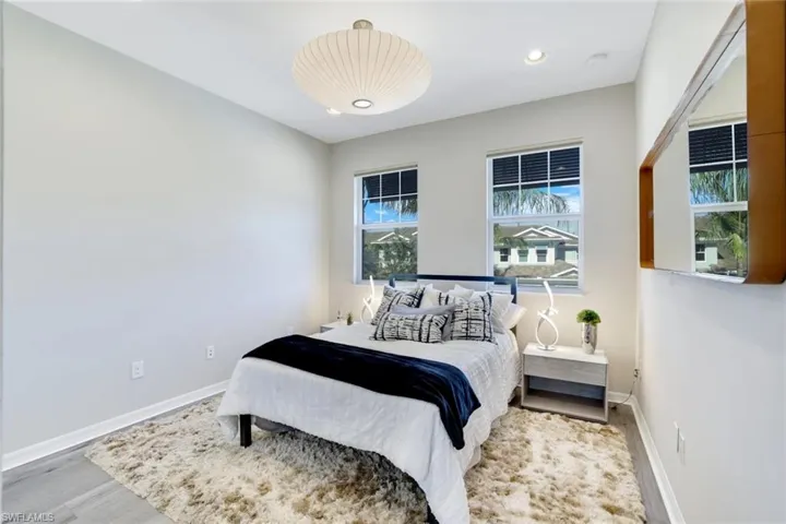Bedroom featuring recessed lighting and wood finished floors