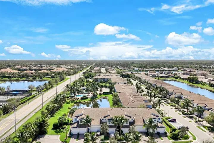 Aerial perspective of suburban area with a large body of water