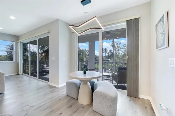 Dining area with baseboards and wood finished floors