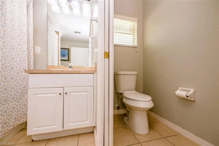 Bathroom featuring vanity and tile patterned floors