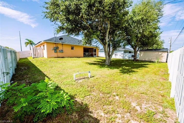 View of fenced backyard